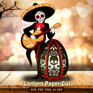 May include: A paper cut design of a skeleton mariachi playing a guitar, with a decorative lantern. The skeleton wears a sombrero and a black suit with a red bow tie. The lantern has a skull design and the text "Lantern Paper Cut".