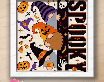 May include: A multi-layered shadow box design featuring three gnomes wearing Halloween hats in purple, orange, and black. The artwork includes pumpkins, bats, candy corn, a skull, and the word SPOOKY in large black letters with orange accents.