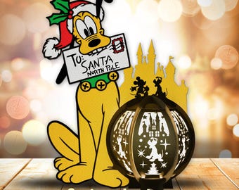 May include: A cartoon lantern featuring a yellow dog with a red Santa hat holding a letter addressed to Santa. The lantern has a round, black base with a white design of a castle and stars. The text on the letter reads "To: Santa North Pole".