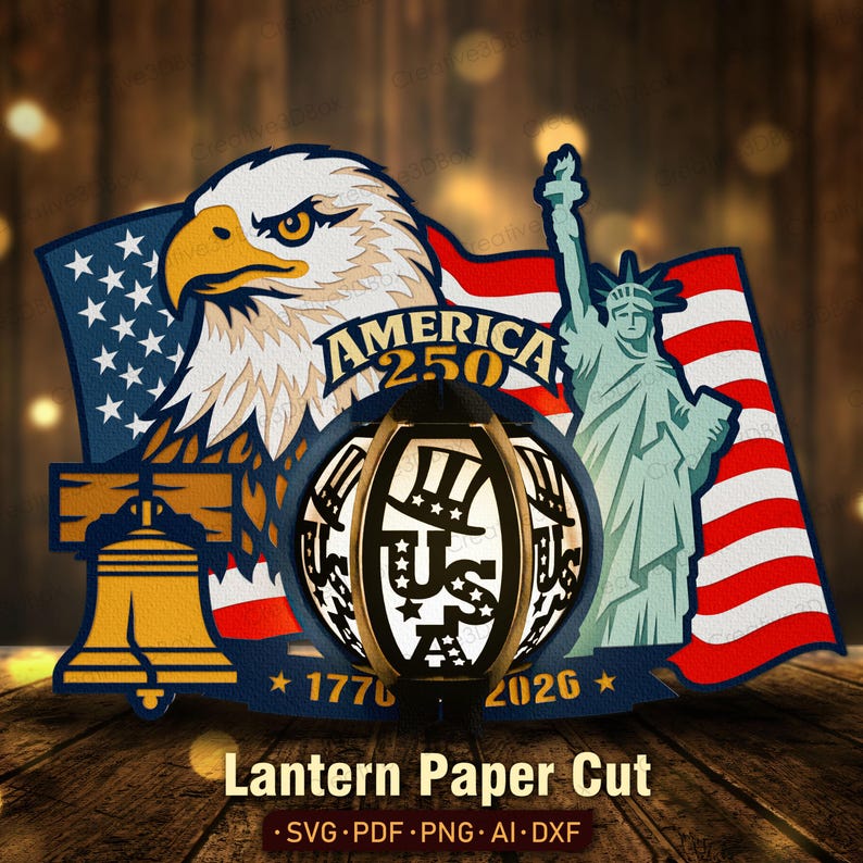 K&ouml;nnte beinhalten: Ein patriotisches Papierschnittdesign mit einem Adler, der amerikanischen Flagge, der Liberty Bell und der Freiheitsstatue. Das Design enth&auml;lt den Text "AMERICA 250" und "1776-2026". Eine Laterne mit "US" und Sternen befindet sich in der Mitte. Der Text "Lantern Paper Cut" steht unten.