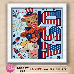 May include: A patriotic shadow box design featuring three Highland cows with American flag-themed accessories. The word "USA" is displayed in red and blue, with stars and stripes. The design includes fireworks and rockets.