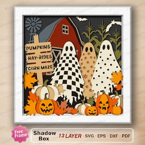 May include: A multi-layered paper shadow box art piece featuring a red barn, a windmill, and corn stalks. Three ghosts with checkered, floral, and polka dot patterns stand before a sign reading PUMPKINS, HAY-RIDES, CORN MAZE, with orange pumpkins.