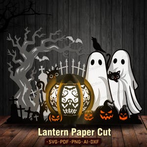 May include: A Halloween paper cut design featuring a glowing pumpkin lantern with a skull design, ghosts, black cats, and jack-o'-lanterns. The design includes a graveyard scene with a tree and the text "Lantern Paper Cut".