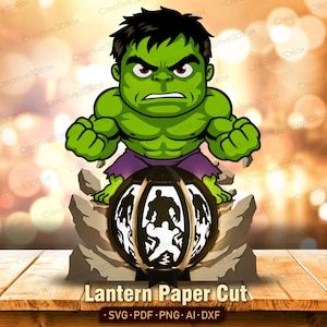 May include: A layered paper cut lantern design featuring a green muscular character with dark hair and purple shorts standing above a circular structure. The circular base displays a silhouette of the same character. Text reads Lantern Paper Cut.