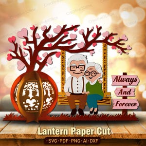 May include: A paper cut design featuring an elderly couple on a swing, with a tree and lantern. The tree has pink heart-shaped leaves. The words "Always And Forever" are on a sign. The text "Lantern Paper Cut" is at the bottom.