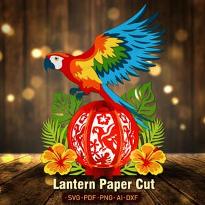 May include: A multi-layered paper cut design featuring a vibrant macaw with blue, yellow, and red feathers perched above a red spherical lantern. The lantern displays intricate cutouts of parrots and hibiscus flowers, flanked by green tropical leaves.