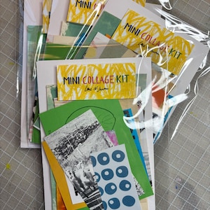 May include: Several mini collage kits in clear plastic packaging. Each kit includes various colorful paper scraps, with some featuring text that reads "MINI COLLAGE KIT". The kits contain a variety of colors and patterns, including green, yellow, blue, and black and white.