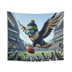 May include: A wall tapestry featuring a cartoon eagle wearing a beanie with the word "SEATTLE" and goggles, holding a football. The eagle is flying over a football field with cheering fans and the words "TOUCHDOWN" and "SEATTLE WINS!"