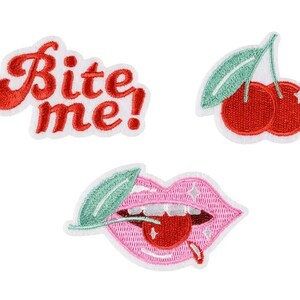 May include: Three embroidered iron-on patches: a red "Bite Me!" text patch, a red cherry patch with a green stem and leaf, and a pink lips patch with a red cherry in the mouth and a green stem and leaf.