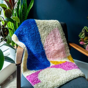 Kreiseln um den großen Knüpfhaken-Teppich-Kit