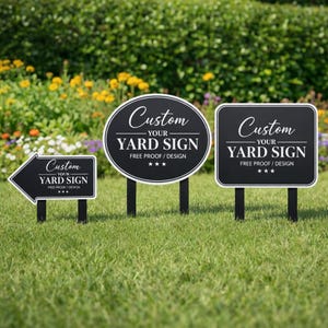 May include: Three black yard signs with white text. The left sign is arrow-shaped, the center is oval, and the right is rectangular. All signs feature the text Custom YOUR YARD SIGN FREE PROOF / DESIGN with three stars below the text.