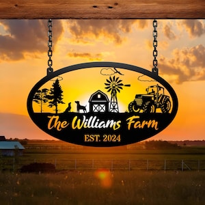 May include: Black metal farm sign with the text "The Williams Farm" and "EST. 2024". The sign features a farm scene with a barn, windmill, tractor, trees, and dogs, hanging from chains against a sunset.