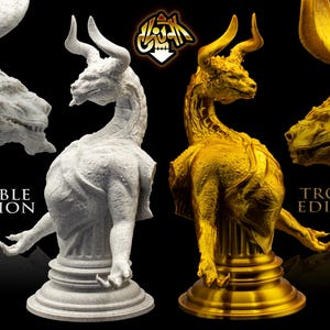 May include: Two versions of a white and gold bull dragon statue. The white version is labeled "Marble Edition" and the gold version is labeled "Trophy Edition".