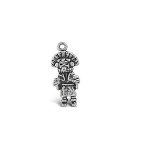 May include: Silver charm depicting a stylised figure wearing a feathered headdress and holding a staff.