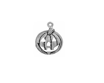 May include: A silver charm in the shape of a jack-o'-lantern with a carved face.