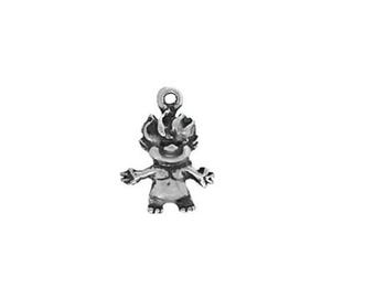 May include: A silver charm in the shape of a troll with spiky hair and a wide smile.
