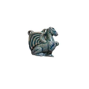 May include: A ceramic dragon figurine with blue and green glaze. The dragon is curled up with its wings spread out.