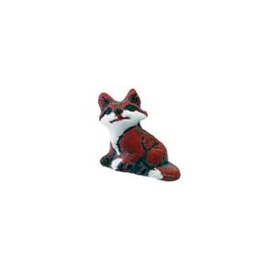 May include: A small ceramic figurine of a red fox sitting with its paws tucked under its body. The fox has white markings on its face and chest.