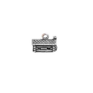 May include: Silver charm in the shape of a log cabin with a chimney. The charm has a loop at the top for attaching to a bracelet or necklace.