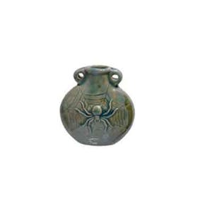 May include: A small, green ceramic vase with a spider web design and a three-dimensional spider in the center. The vase has two handles on the sides.