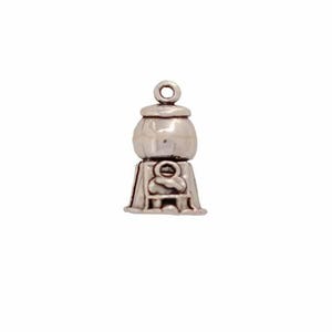 Może przedstawiać: Srebrny charm w kształcie automatu do gum do żucia. Charm ma okrągły, srebrny pojemnik na gumy do żucia ze srebrną pokrywką i srebrną podstawą z małym, srebrnym uchwytem.