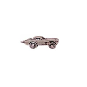 May include: A silver charm in the shape of a classic sports car. The car is detailed with a windshield, headlights, and wheels.