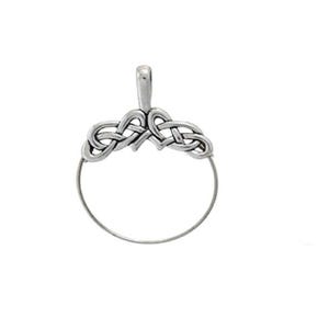 May include: Silver Celtic knot pendant with a circular opening. The knot design features two intertwined hearts.