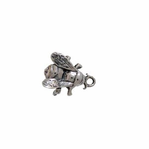 May include: Silver bee charm with detailed wings and a textured body. The charm has a loop for attaching to a bracelet or necklace.