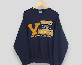 Sudadera vintage de los West Virginia Mountaineers de la NCAA, talla XL, con estampado del nombre de West Virginia. Suéter de cuello redondo talla XL.
