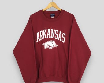 Sudadera vintage de los Arkansas Razorbacks de los años 90, color rojo, talla XL, de la NCAA. Sudadera de cuello redondo con el logotipo estampado de los Arkansas Razorbacks, talla XL.