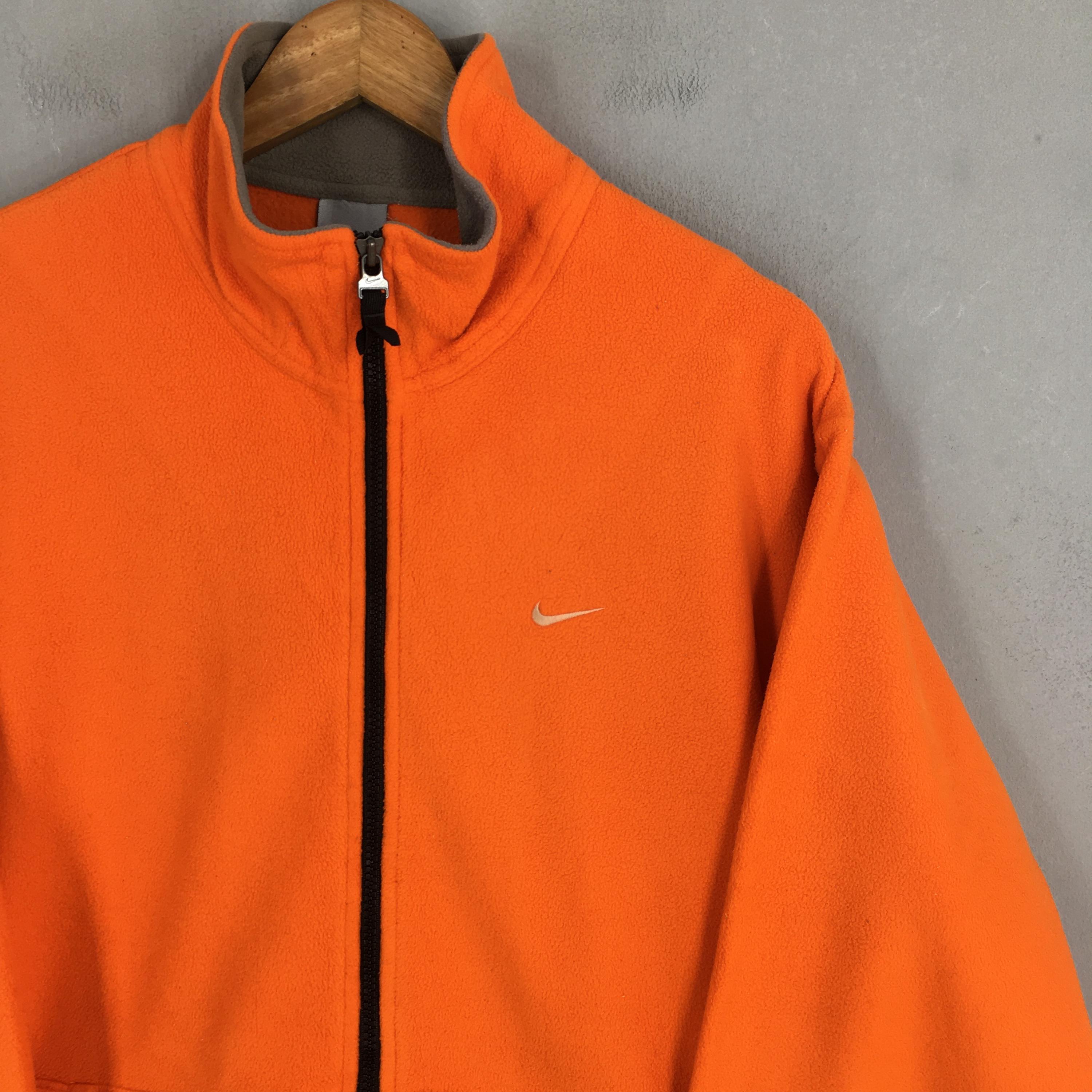 orange nike zip up