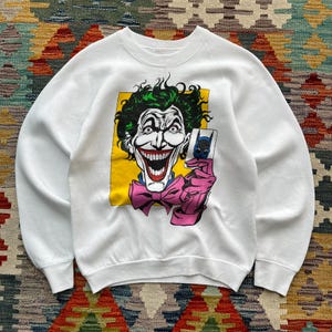 May include: A set of three ceramic mugs with a speckled, matte finish. The mugs are in shades of cream, light gray, and dark gray. Each mug has a simple, minimalist design, perfect for coffee or tea.