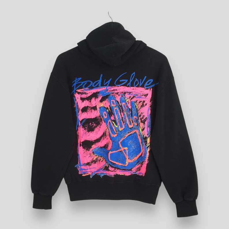 May include: Black hoodie with a graphic design on the back. The design features a blue hand inside a pink and orange square, with the words "Body Glove" in blue above the hand.