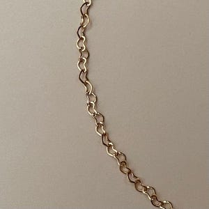 Collar de cadena con forma de corazón