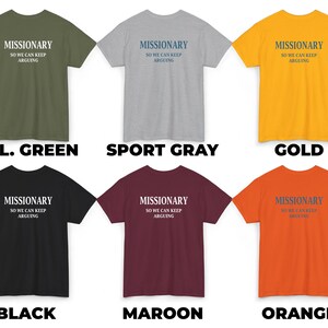 May include: A collection of six t-shirts in various colors: military green, sport gray, gold, black, maroon, and orange. Each shirt features the text "MISSIONARY SO WE CAN KEEP ARGUING" in a contrasting color. The shirts are short-sleeved.