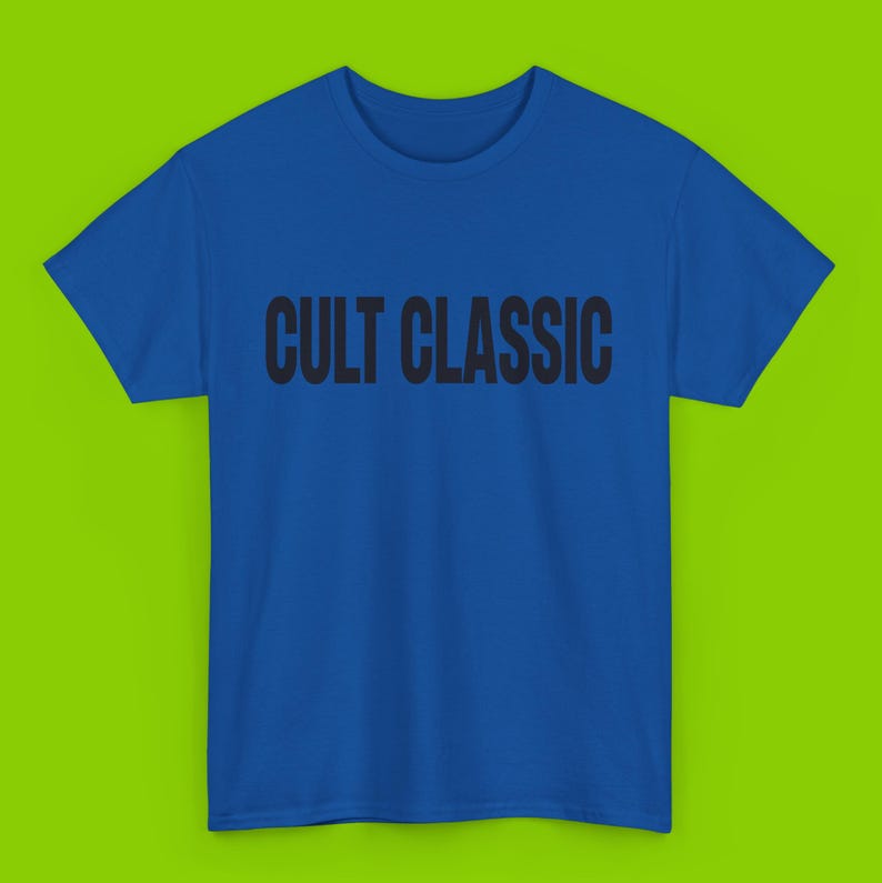 May include: A royal blue t-shirt with the text "CULT CLASSIC" printed in black.