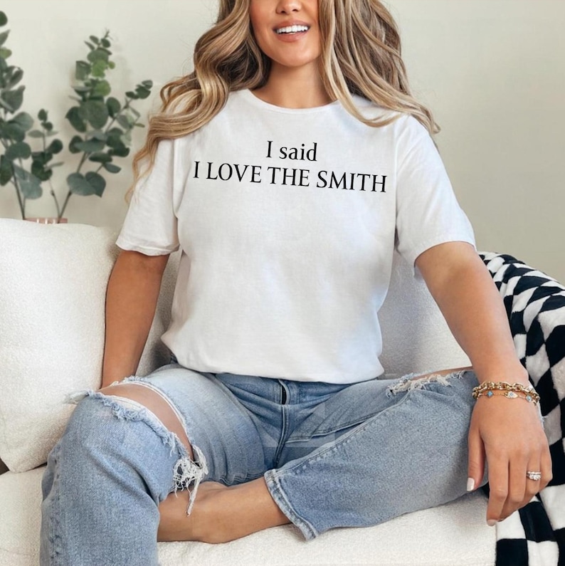 May include: A white t-shirt with the text "I said I LOVE THE SMITH" printed in black.