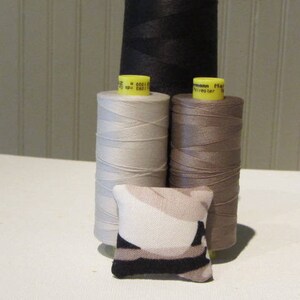 1&quot; Scale Dollhouse Pillow in a Graphic Print in Black/White and Shades of Tan.