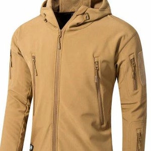 May include: A tan hooded jacket with multiple zipped pockets and a full-length zip closure. The jacket has a tactical design with patches on the sleeves and a hood with a drawstring. The jacket is made of a durable, water-resistant material.