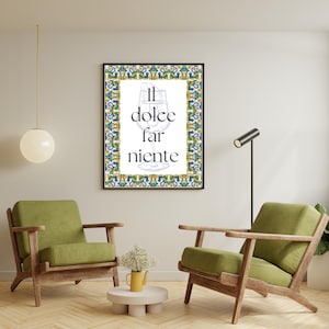 May include: A framed print with a blue, green and yellow border. The print features a glass of wine with the text "Il dolce far niente" in black.