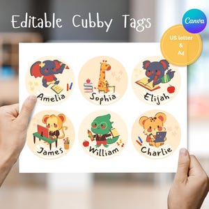 May include: A sheet of six circular editable cubby tags featuring cartoon animals including an elephant, giraffe, koala, monkey, dinosaur, and leopard. Each tag displays a name: Amelia, Sophia, Elijah, James, William, and Charlie, with school-themed illustrations.