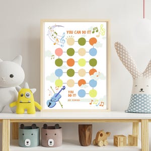 May include: A framed reward chart featuring a grid of colorful circles, musical notes, and a blue violin illustration. The text reads YOU CAN DO IT! at the top and YOU DID IT! MY REWARD at the bottom, set against a white background with clouds.