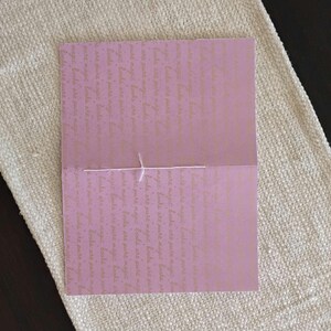A handmade Bible study journal with a faith-inspired design. The cover features hand-lettered scripture, floral accents, and soft pastel tones. Inside, the journal includes lined, dotted, and blank pages for note-taking, prayer journaling, and reflection. Divider tabs help organize scripture studies, sermon notes, and daily devotions. Ideal for personal use or gifting, this thoughtful journal encourages spiritual growth and creativity.