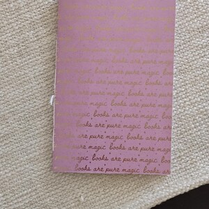 A handmade Bible study journal with a faith-inspired design. The cover features hand-lettered scripture, floral accents, and soft pastel tones. Inside, the journal includes lined, dotted, and blank pages for note-taking, prayer journaling, and reflection. Divider tabs help organize scripture studies, sermon notes, and daily devotions. Ideal for personal use or gifting, this thoughtful journal encourages spiritual growth and creativity.