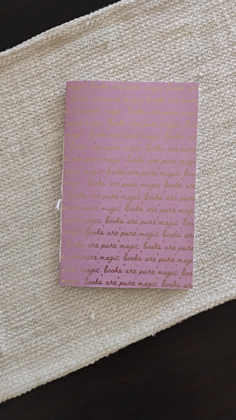 A handmade Bible study journal with a faith-inspired design. The cover features hand-lettered scripture, floral accents, and soft pastel tones. Inside, the journal includes lined, dotted, and blank pages for note-taking, prayer journaling, and reflection. Divider tabs help organize scripture studies, sermon notes, and daily devotions. Ideal for personal use or gifting, this thoughtful journal encourages spiritual growth and creativity.