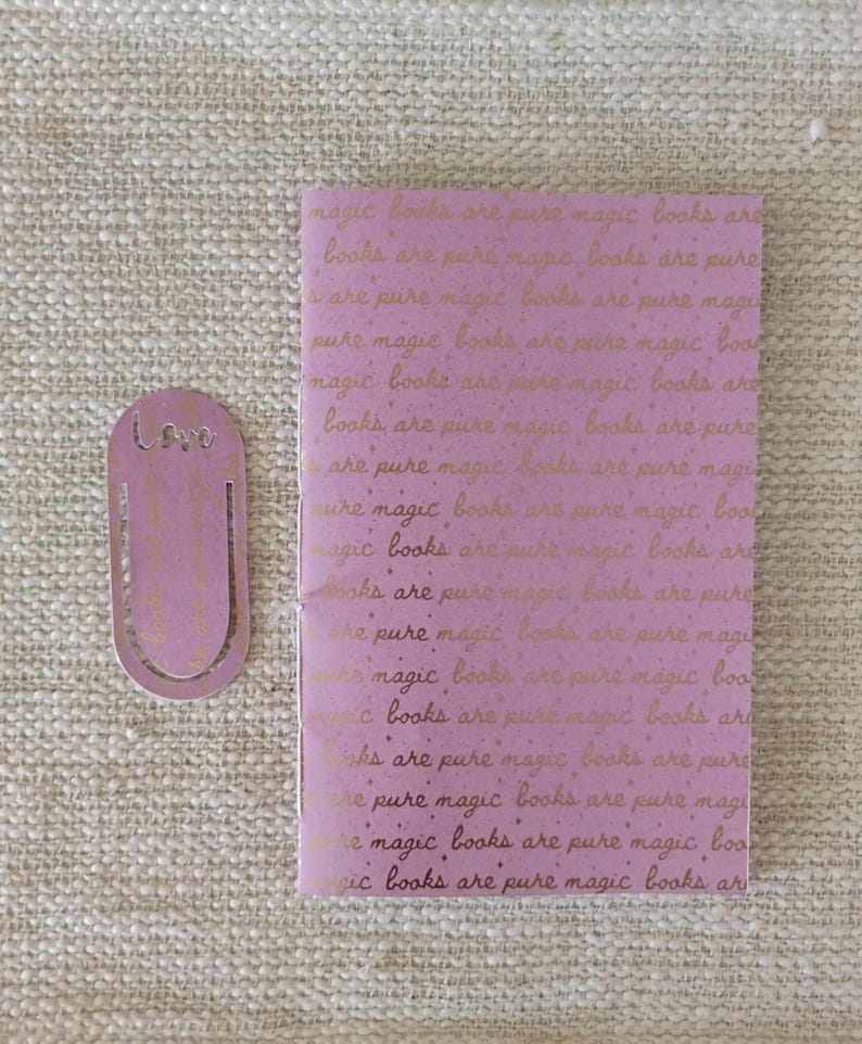A handmade Bible study journal with a faith-inspired design. The cover features hand-lettered scripture, floral accents, and soft pastel tones. Inside, the journal includes lined, dotted, and blank pages for note-taking, prayer journaling, and reflection. Divider tabs help organize scripture studies, sermon notes, and daily devotions. Ideal for personal use or gifting, this thoughtful journal encourages spiritual growth and creativity.