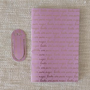 A handmade Bible study journal with a faith-inspired design. The cover features hand-lettered scripture, floral accents, and soft pastel tones. Inside, the journal includes lined, dotted, and blank pages for note-taking, prayer journaling, and reflection. Divider tabs help organize scripture studies, sermon notes, and daily devotions. Ideal for personal use or gifting, this thoughtful journal encourages spiritual growth and creativity.