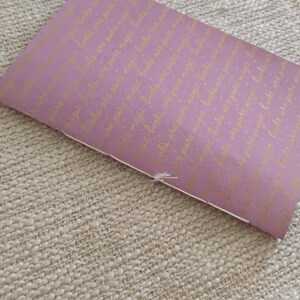 A handmade Bible study journal with a faith-inspired design. The cover features hand-lettered scripture, floral accents, and soft pastel tones. Inside, the journal includes lined, dotted, and blank pages for note-taking, prayer journaling, and reflection. Divider tabs help organize scripture studies, sermon notes, and daily devotions. Ideal for personal use or gifting, this thoughtful journal encourages spiritual growth and creativity.