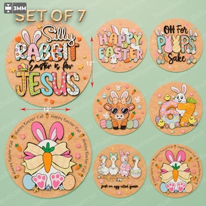 Puede incluir: Conjunto de 7 decoraciones de Pascua de madera. Un letrero redondo grande con el texto "Silly Rabbit Easter is for Jesus". Seis letreros redondos más pequeños con diseños de conejos, huevos y pollitos. Cada letrero mide unos 30 cm de diámetro.
