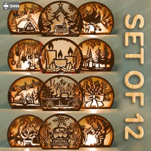 May include: A set of 12 laser-cut wooden Christmas decorations. Each decoration is a semi-circular design with various holiday scenes, including a church, Santa Claus, and a truck with the text "Merry Christmas". The decorations are approximately 10 inches wide.